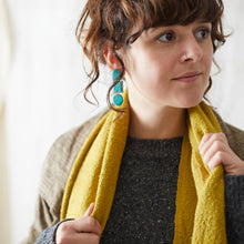 Woman wearing mustard yellow vegan banana yarn scarf by AURA QUE
