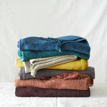 Folded BIBEK banana yarn scarves in multiple colourways