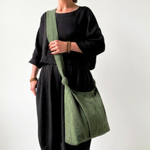 Handmade ivy green cotton shoulder bag with soft slouchy silhouette and knotted shoulder straps