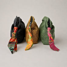 Three handmade cotton cosmetic pouches in black mustard and green with colourful artisan zip pull details