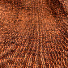 Detailed close-up of amber orange woven cotton fabric texture used in handmade boho tote bags
