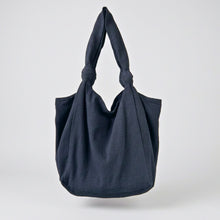 Handmade black cotton slouch tote bag with knotted shoulder straps and minimalist oversized design