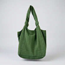 Minimalist ivy green cotton shoulder tote bag with knotted handles and oversized everyday carry design
