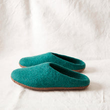 Handmade teal wool MITA mule slippers in a blue-green shade with felted wool uppers and suede soles.