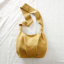 Mustard yellow handwoven cotton crossbody bag with roomy slouchy shape and long comfortable strap.